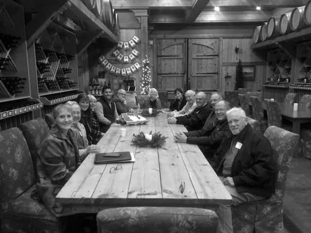 Board Members and Trustees sitting down around a long table