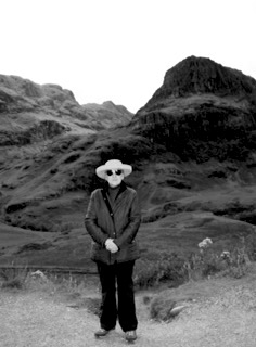 Amanda Thompson posing for a photo with mountains in the background